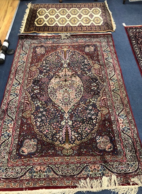 A Kashan style rug and a Bokhara rug Larger 202 x 141cm